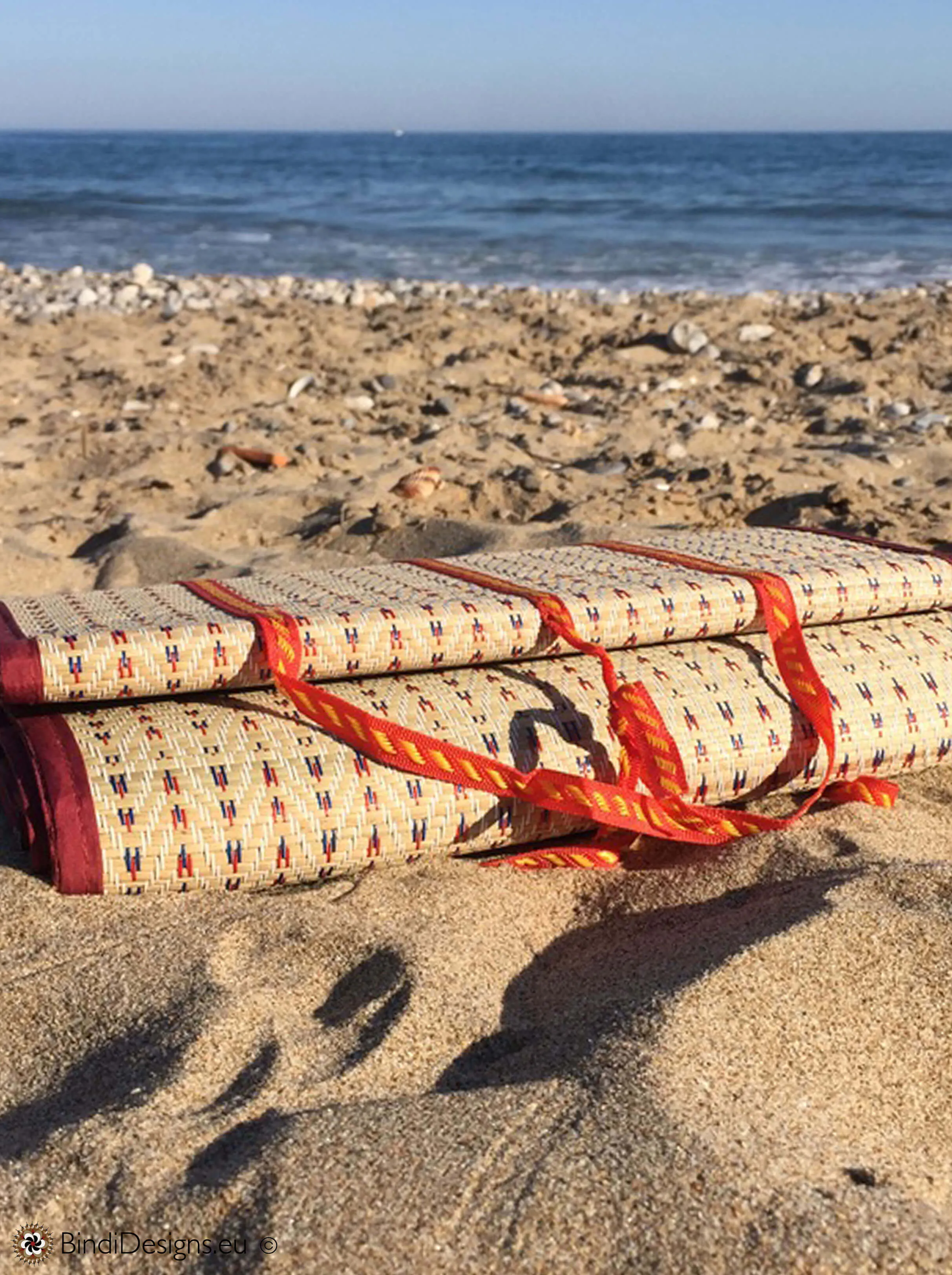 Handwoven Natural Reed Fold up Mat with Dark Red Trim